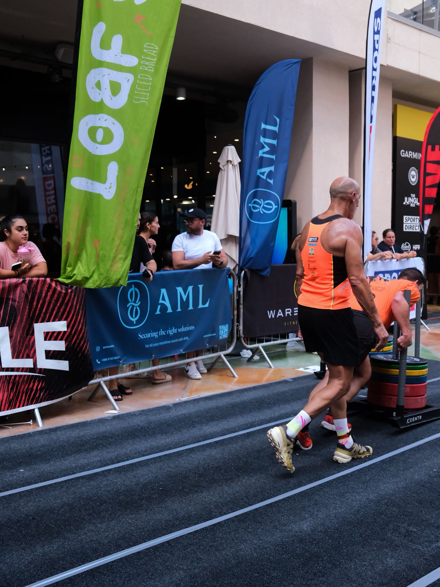 Athletes doing Sled Push.